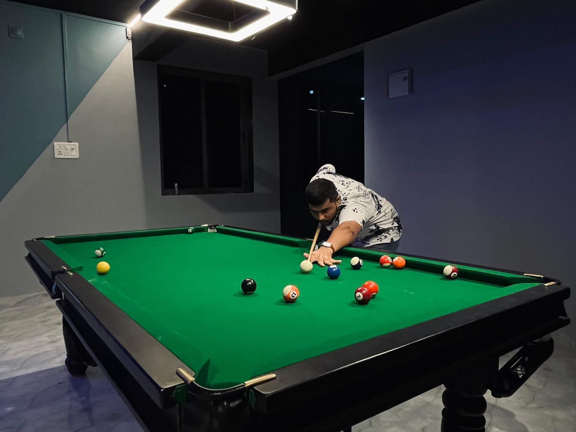 Player lining up a shot on the premium pool table